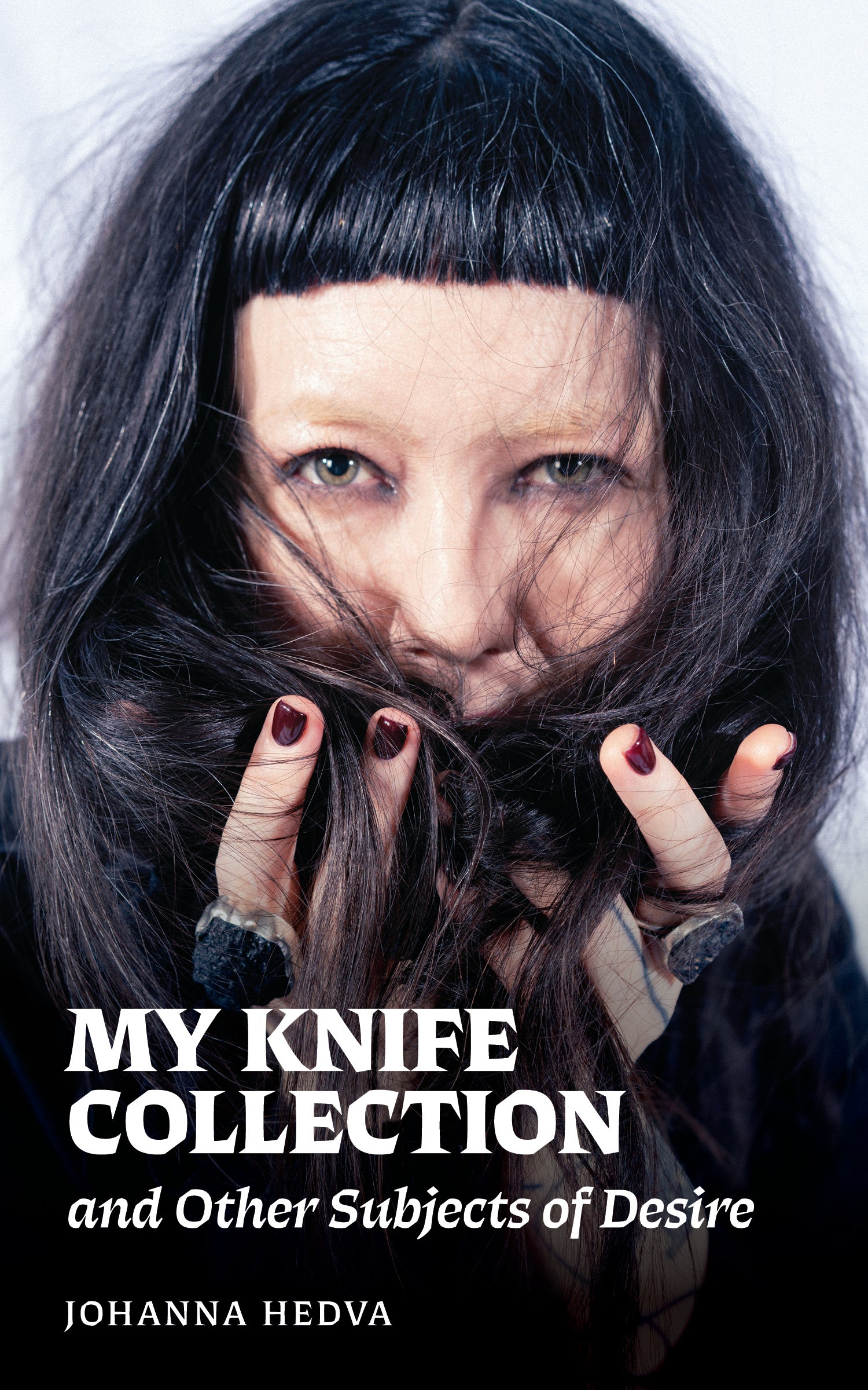 Book cover for 'My Knife Collection and Other Subjects of Desire' by Johanna Hedva, featuring a close-up portrait of a witch with dark hair covering part of their face, with bold white title text at the bottom.